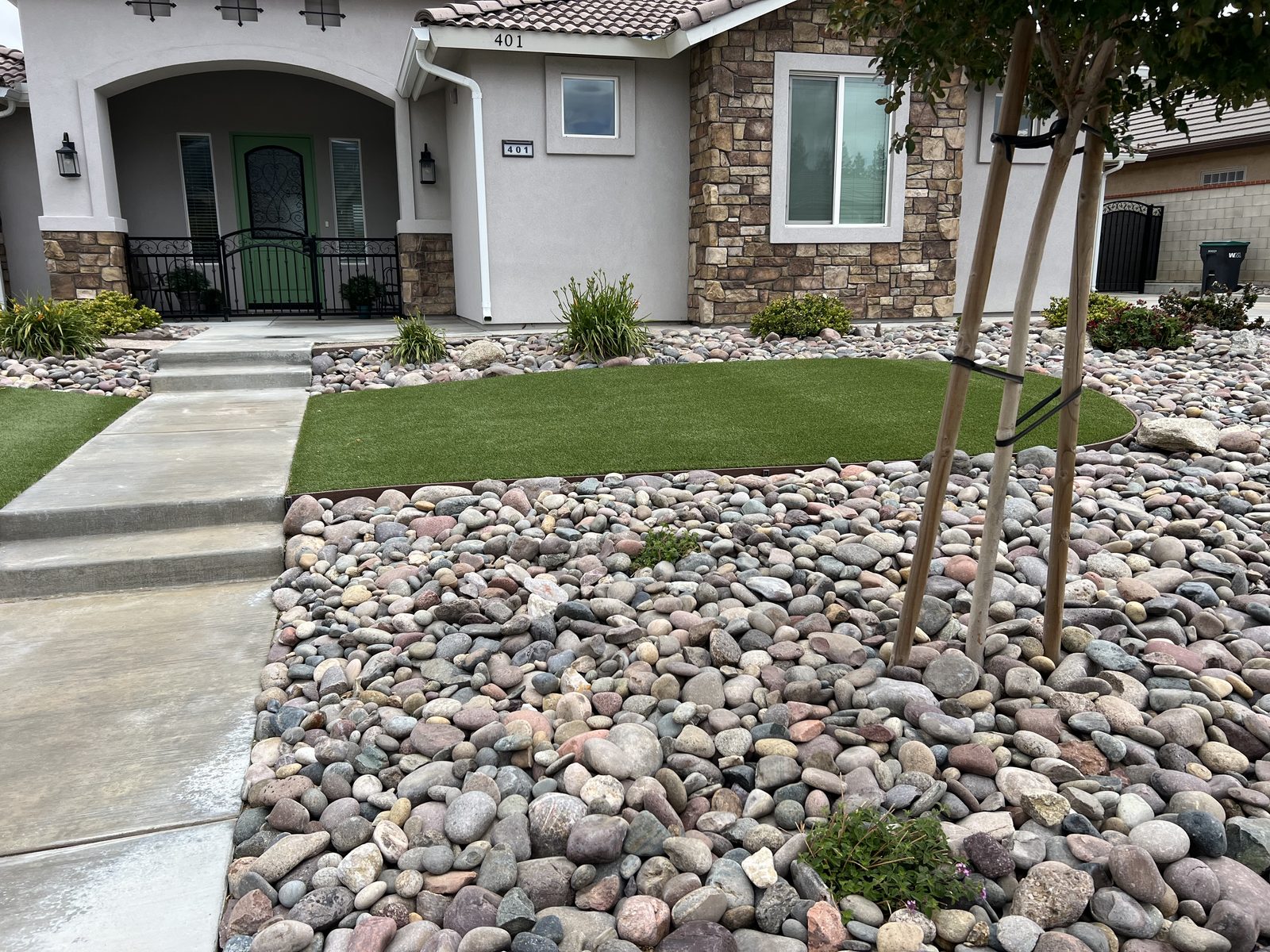 Front entry walkway with turf and rock