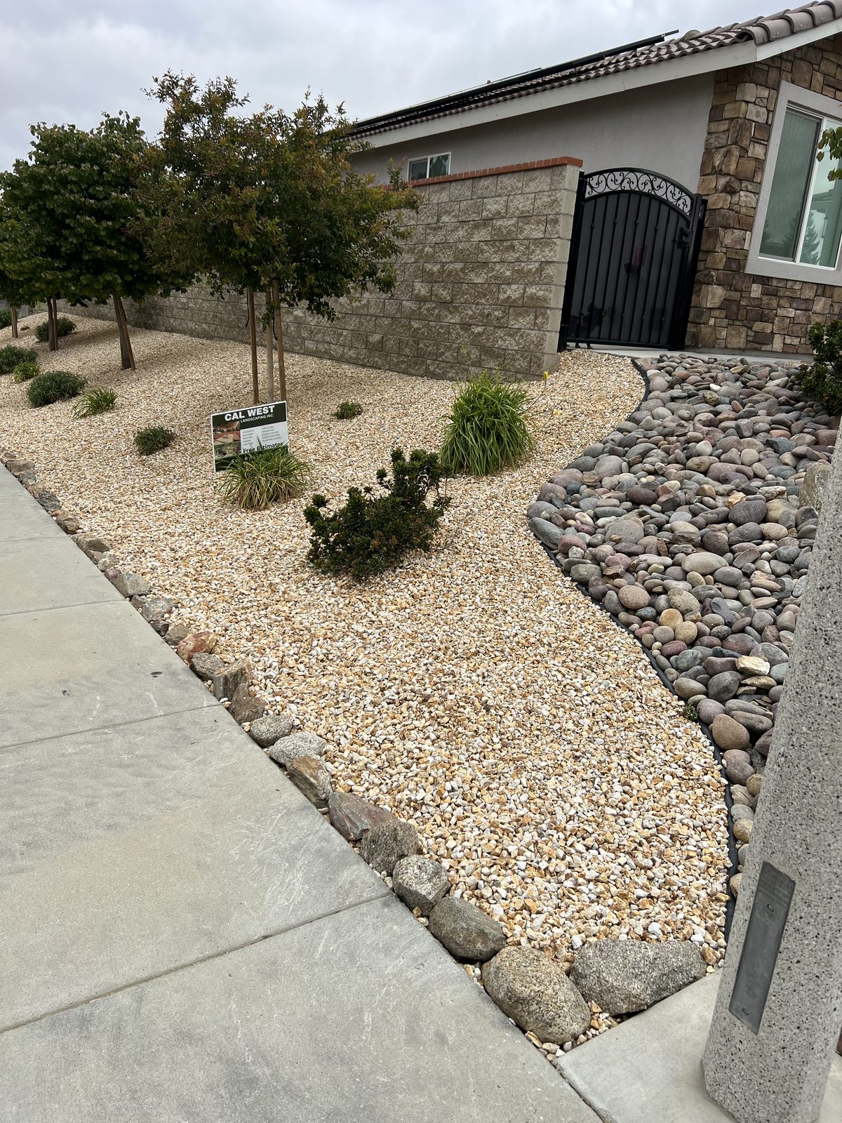Front yard landscaping with courtyard gate