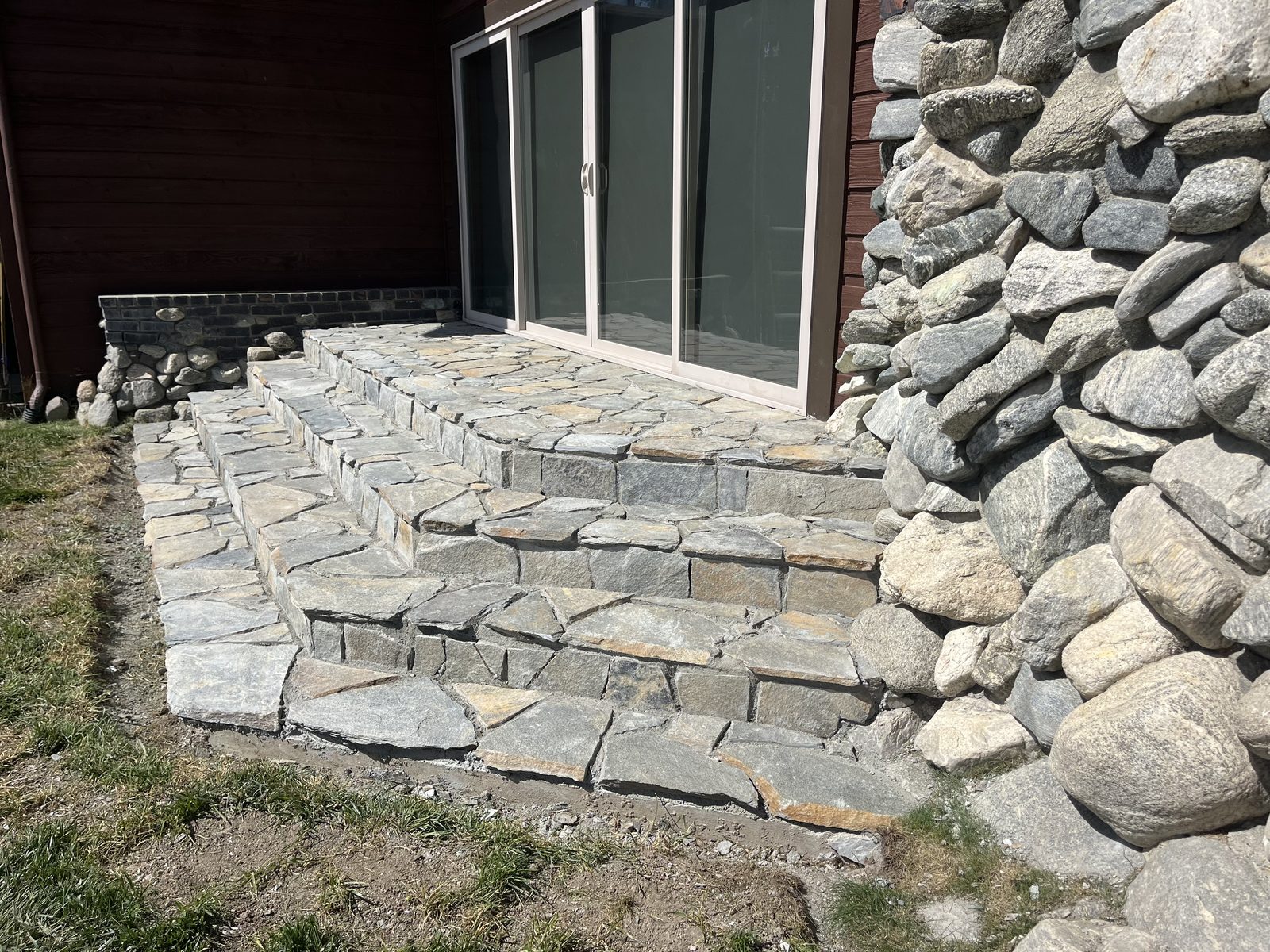 Natural stone steps and river rock masonry